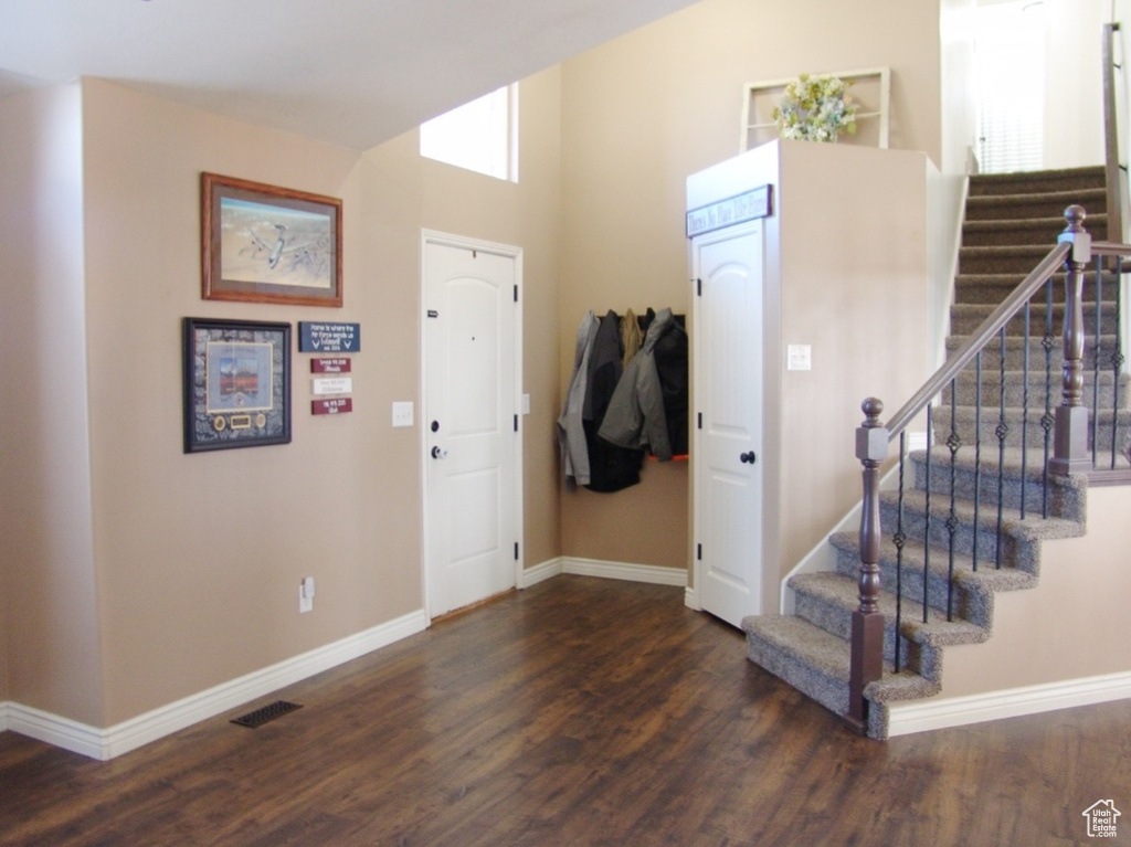 Foyer entrance featuring dark hardwood / wood-style floors