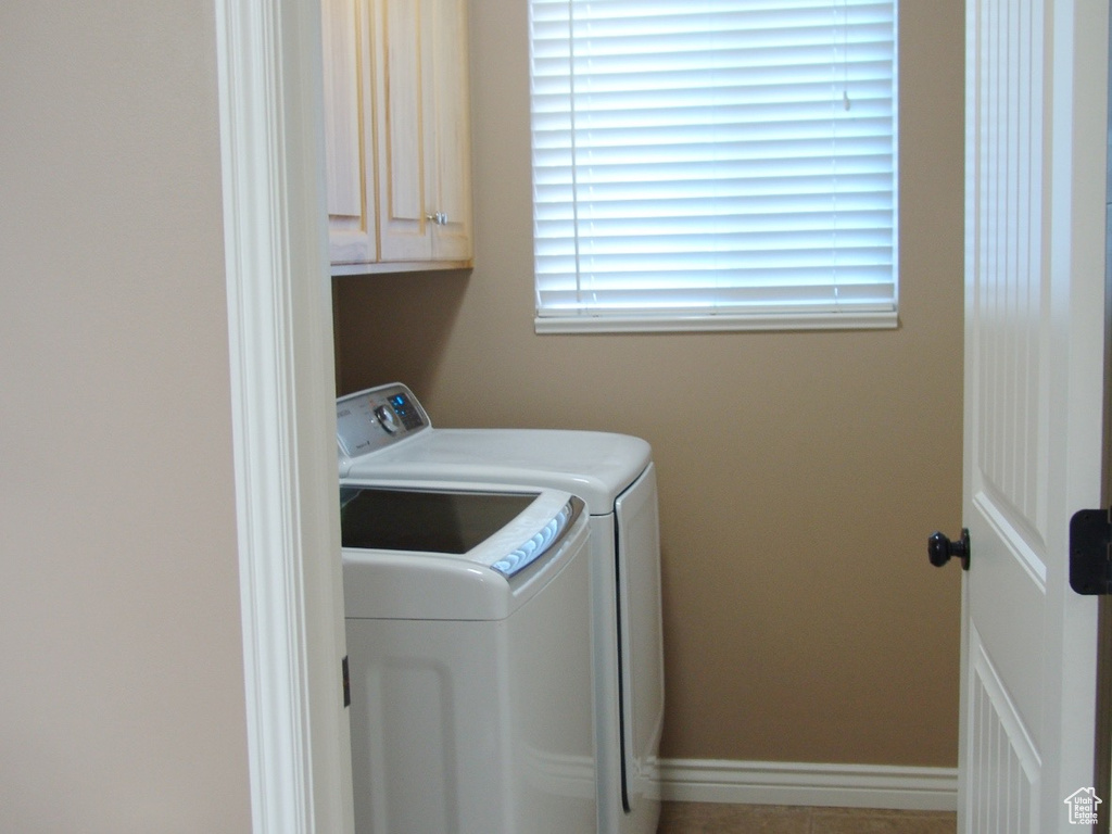 Clothes washing area with independent washer and dryer and cabinets