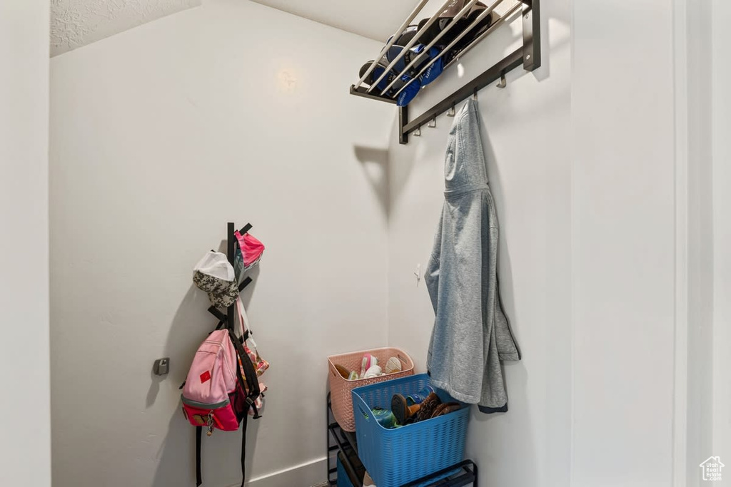 Mudroom with lofted ceiling
