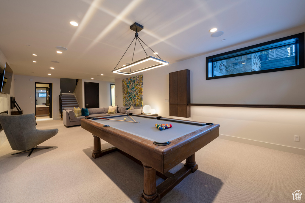 Recreation room with light carpet and billiards