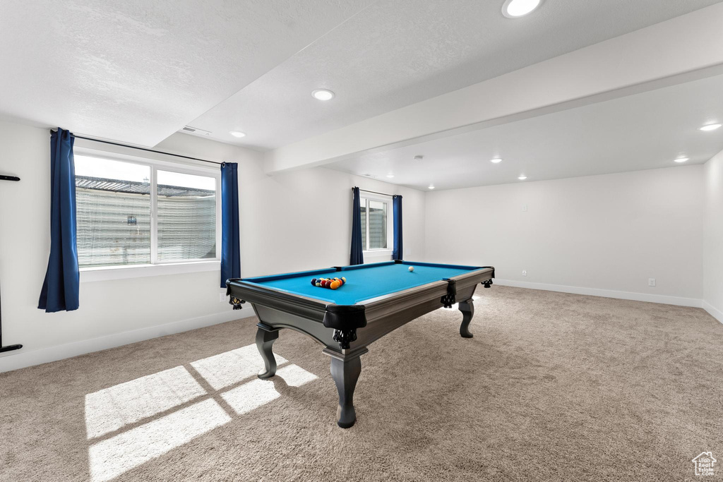 Rec room featuring light colored carpet, a textured ceiling, and pool table