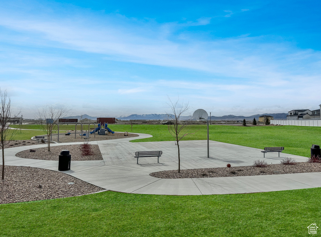 Surrounding community featuring a lawn and a playground