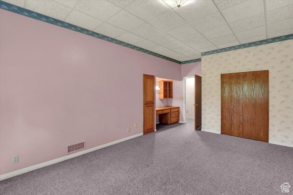Unfurnished bedroom with a paneled ceiling