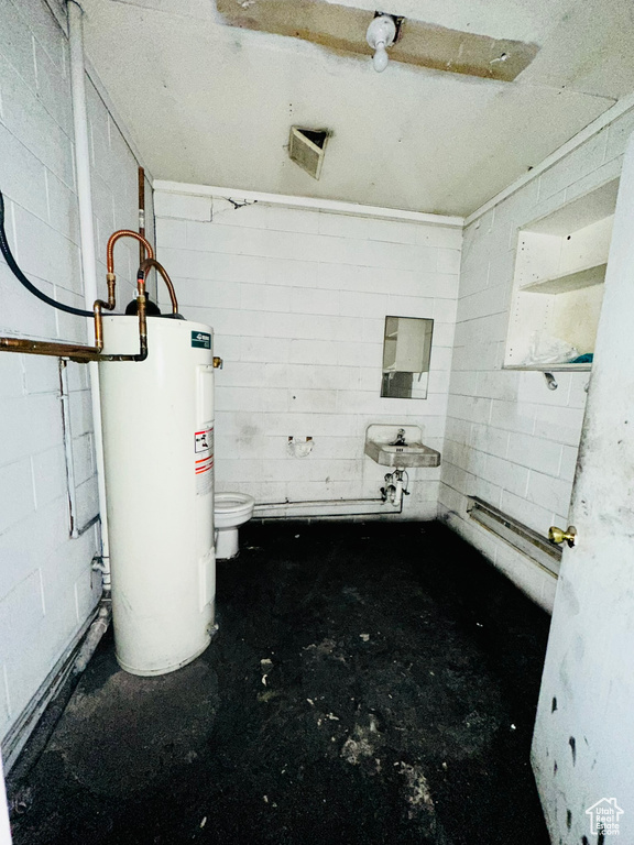 Bathroom featuring toilet and electric water heater