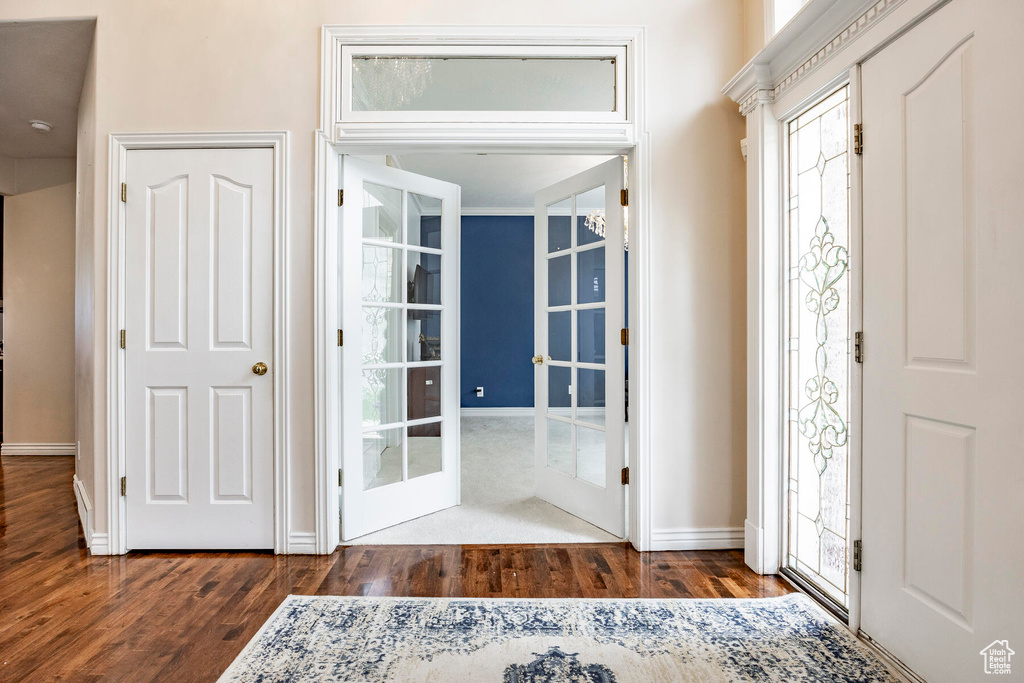 Entryway with french doors and dark hardwood / wood-style floors