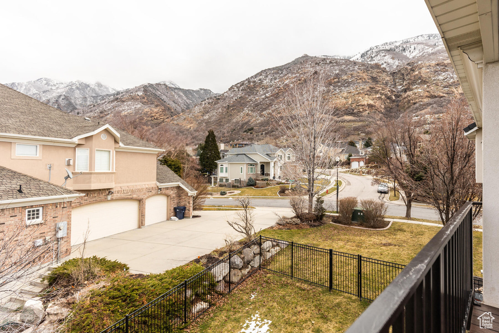 View of yard featuring a mountain view and a garage