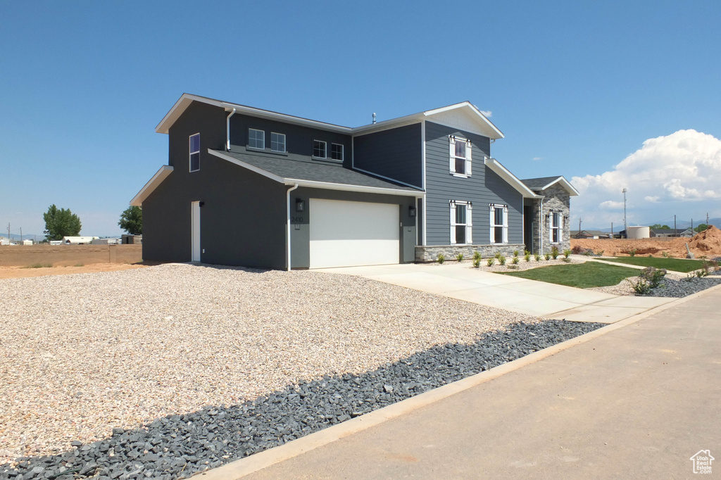 Front of property featuring a garage