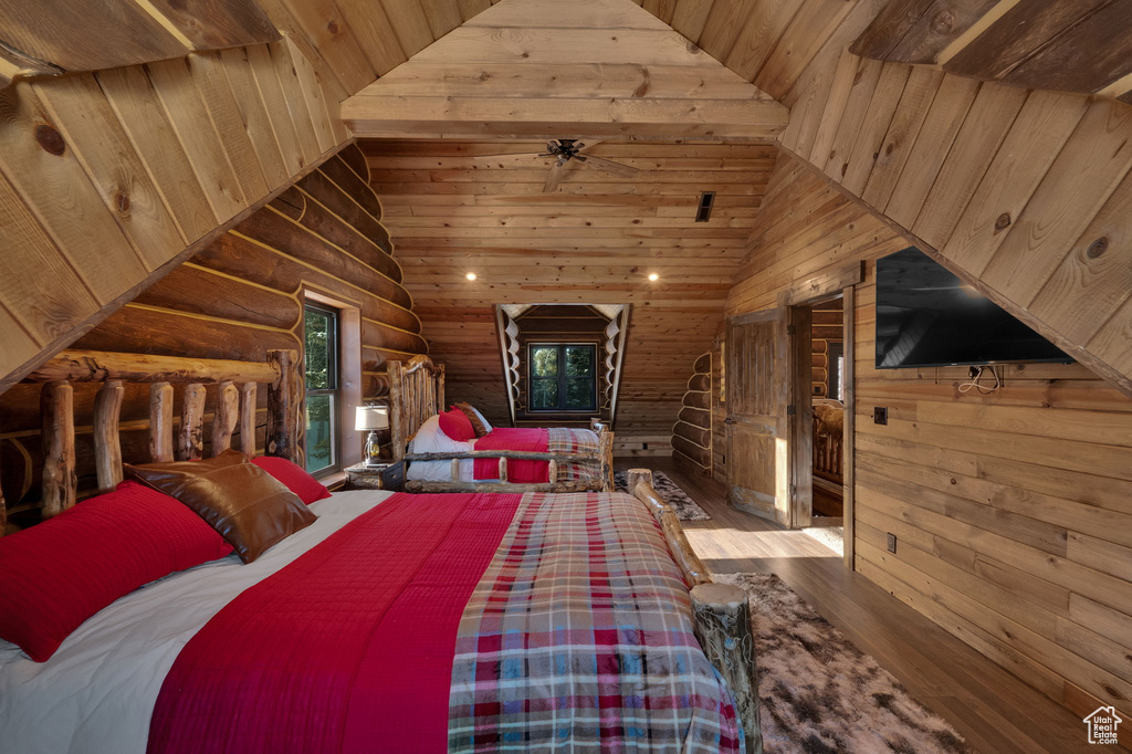 Bedroom featuring lofted ceiling, wooden ceiling, and hardwood / wood-style floors