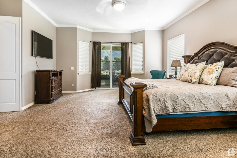 Bedroom featuring access to exterior, ornamental molding, carpet floors, and ceiling fan