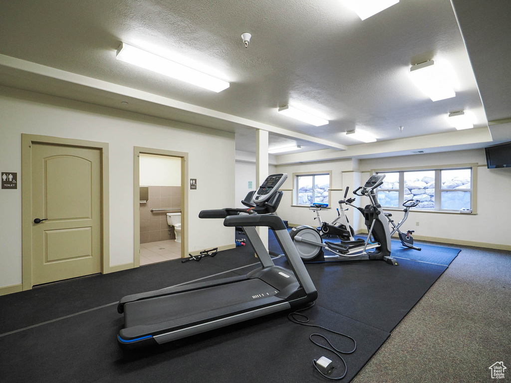 Exercise room featuring a textured ceiling