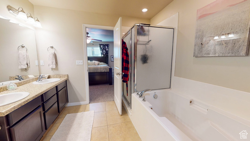 Bathroom with tile floors, ceiling fan, shower with separate bathtub, and dual bowl vanity