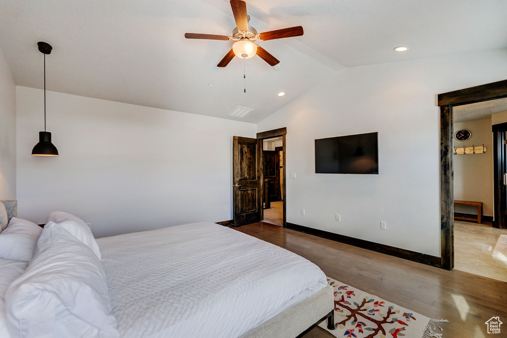 Bedroom featuring high vaulted ceiling, light wood-type flooring, and ceiling fan