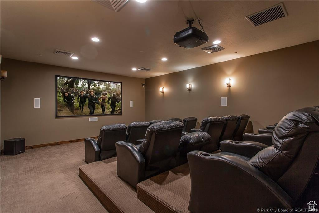 Home theater featuring light colored carpet