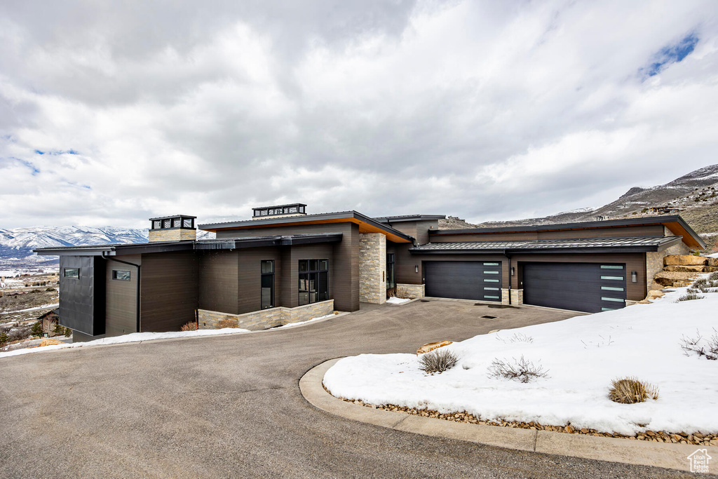 Prairie-style home with a garage