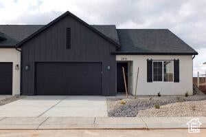 View of front facade featuring a garage