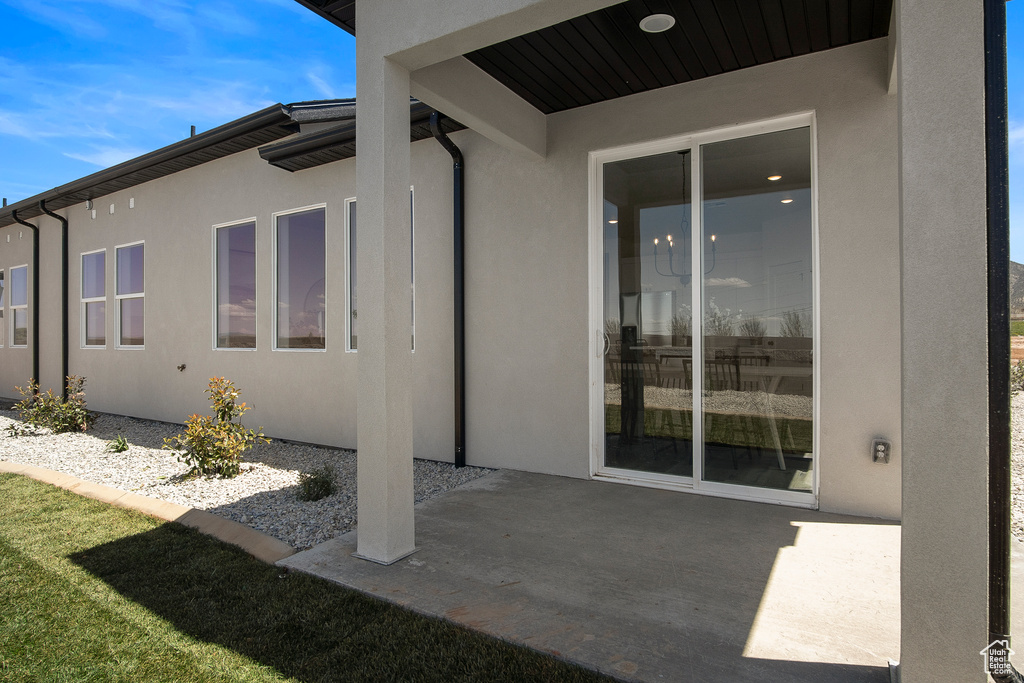 Entrance to property featuring a patio