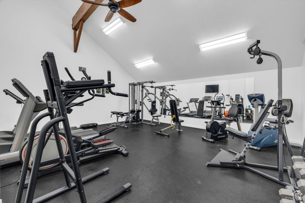 Gym featuring lofted ceiling and ceiling fan