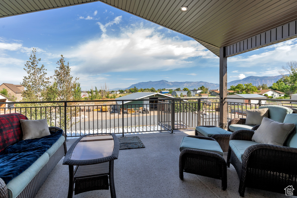View of patio with a mountain view and outdoor lounge area