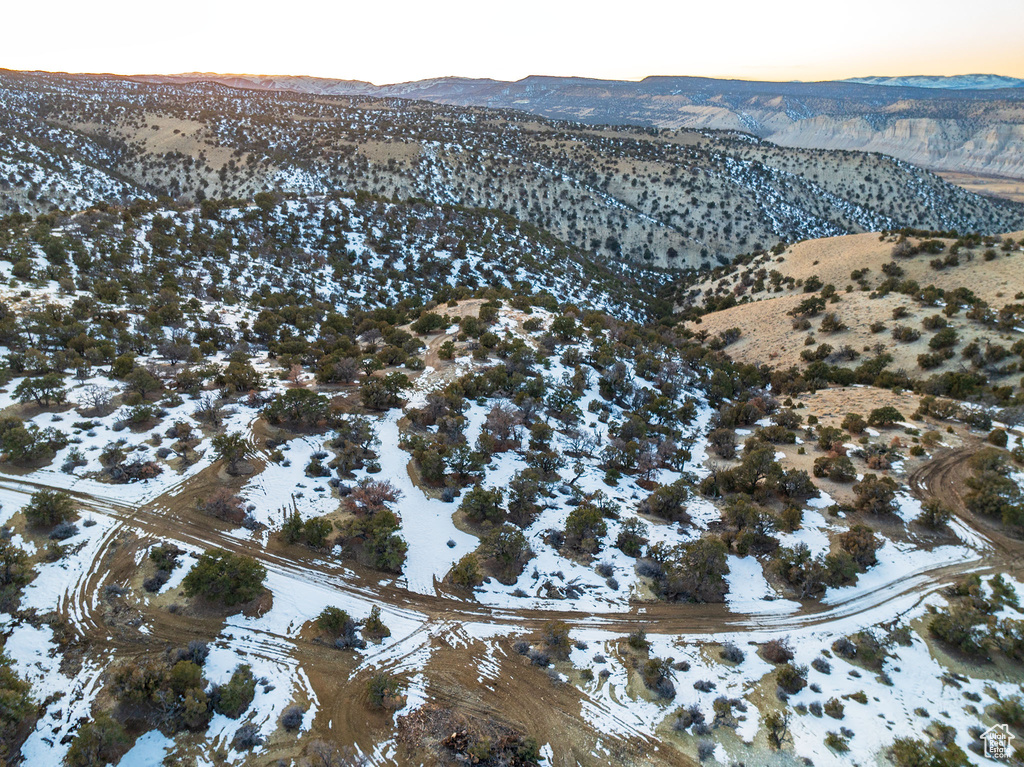 Snowy aerial view featuring a mountain view