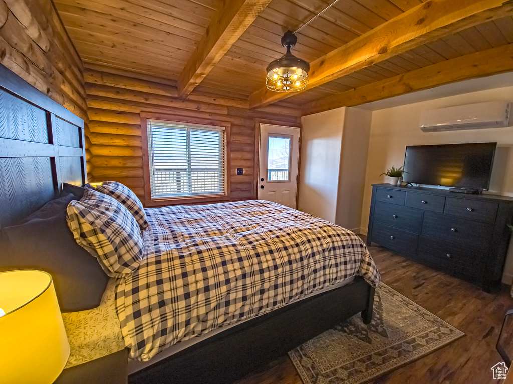 Bedroom featuring dark hardwood / wood-style flooring, wood ceiling, a wall mounted air conditioner, and rustic walls
