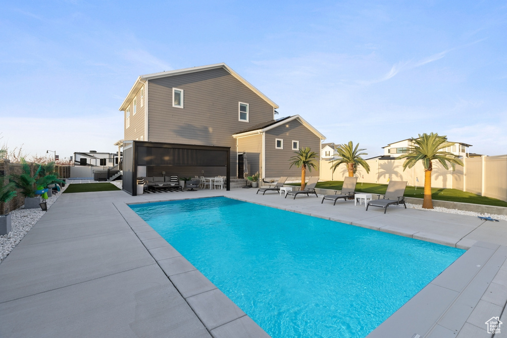 View of pool featuring an outdoor hangout area and a patio area