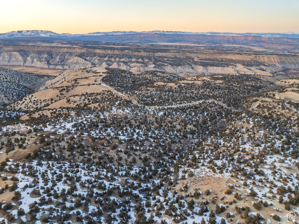 Aerial view at dusk featuring a mountain view