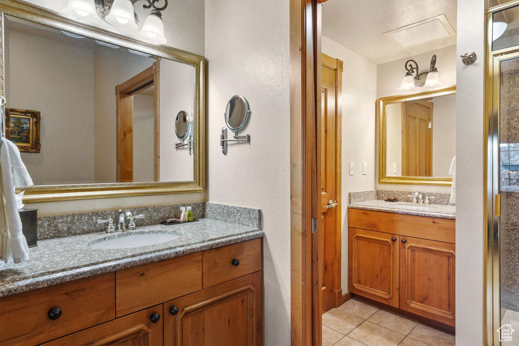 Bathroom with oversized vanity and tile flooring