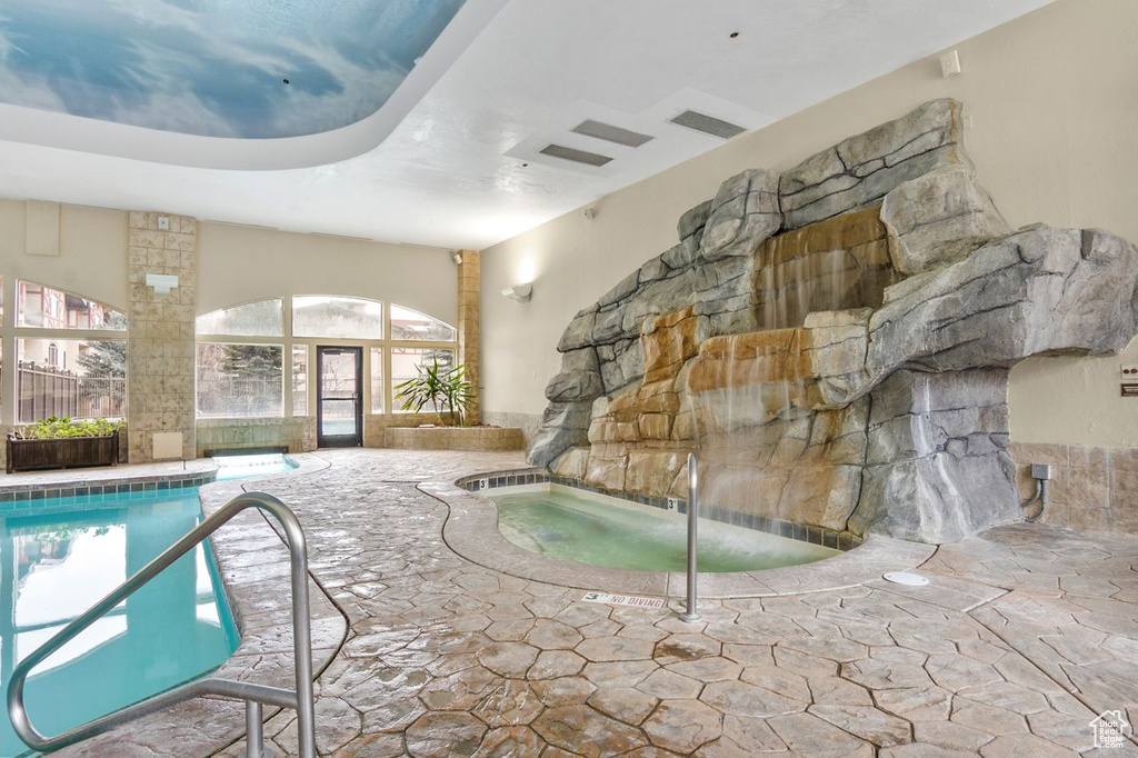 View of pool featuring an indoor hot tub