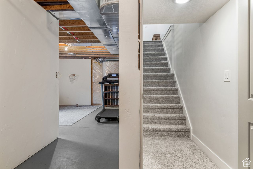 Stairway with concrete flooring
