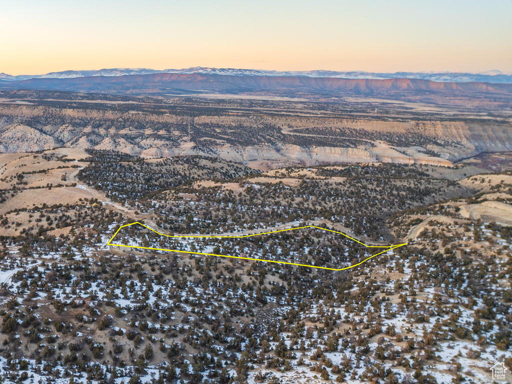 Aerial view at dusk featuring a mountain view