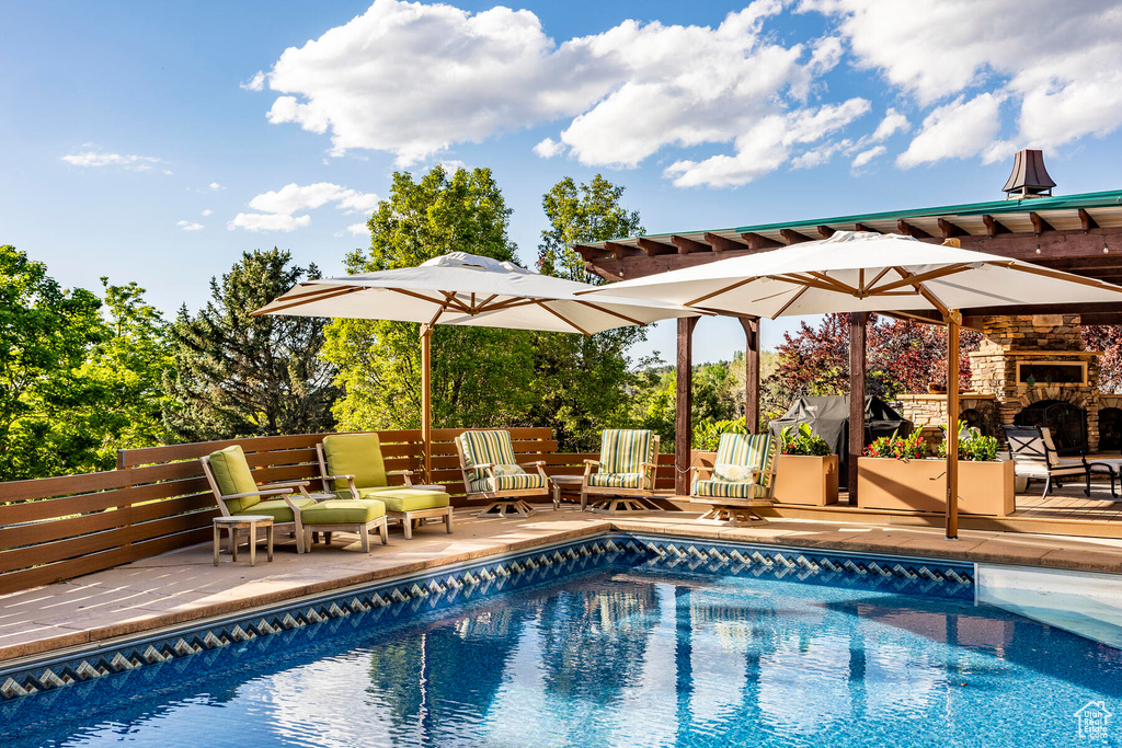 View of swimming pool with a patio