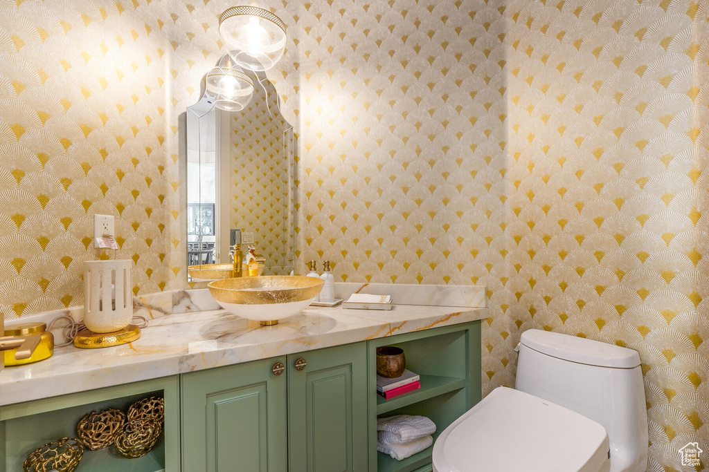 Bathroom featuring vanity and toilet