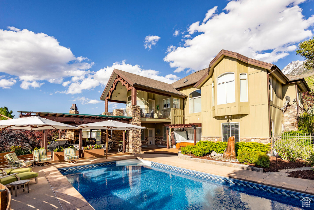 View of swimming pool featuring a patio