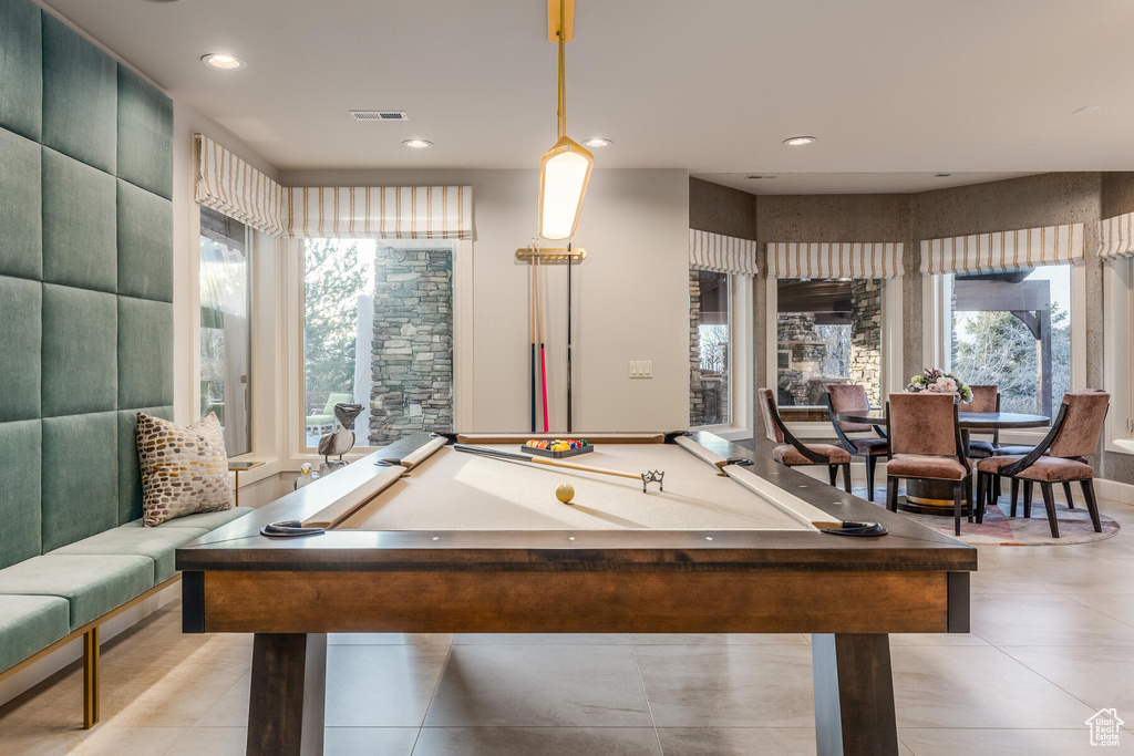 Game room featuring a wealth of natural light, light tile floors, and billiards