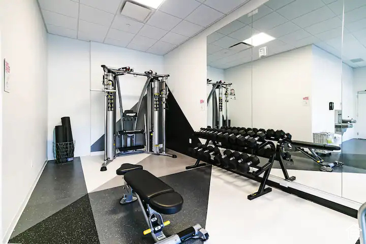 Exercise area featuring a drop ceiling
