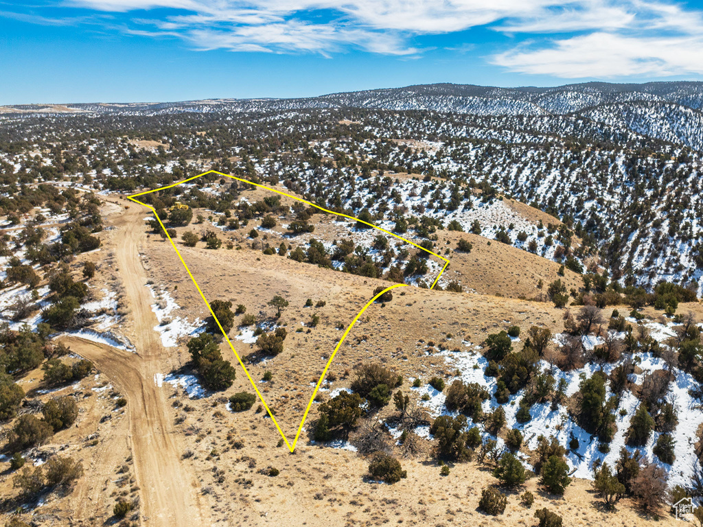 Birds eye view of property with a mountain view