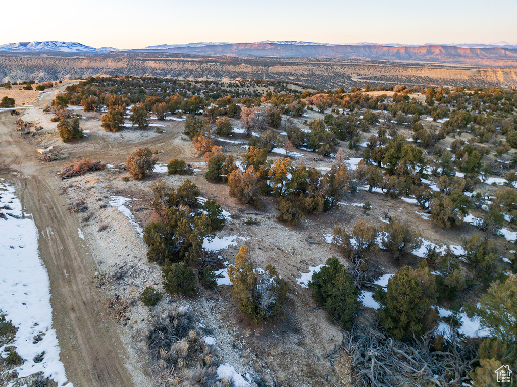 Aerial view at dusk featuring a mountain view