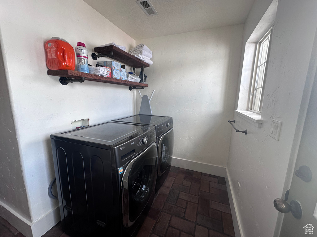 Clothes washing area with separate washer and dryer and washer hookup