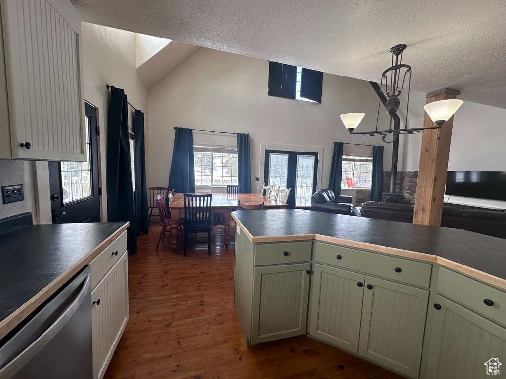 Kitchen featuring plenty of natural light, a chandelier, dishwasher, hardwood / wood-style floors, and decorative light fixtures