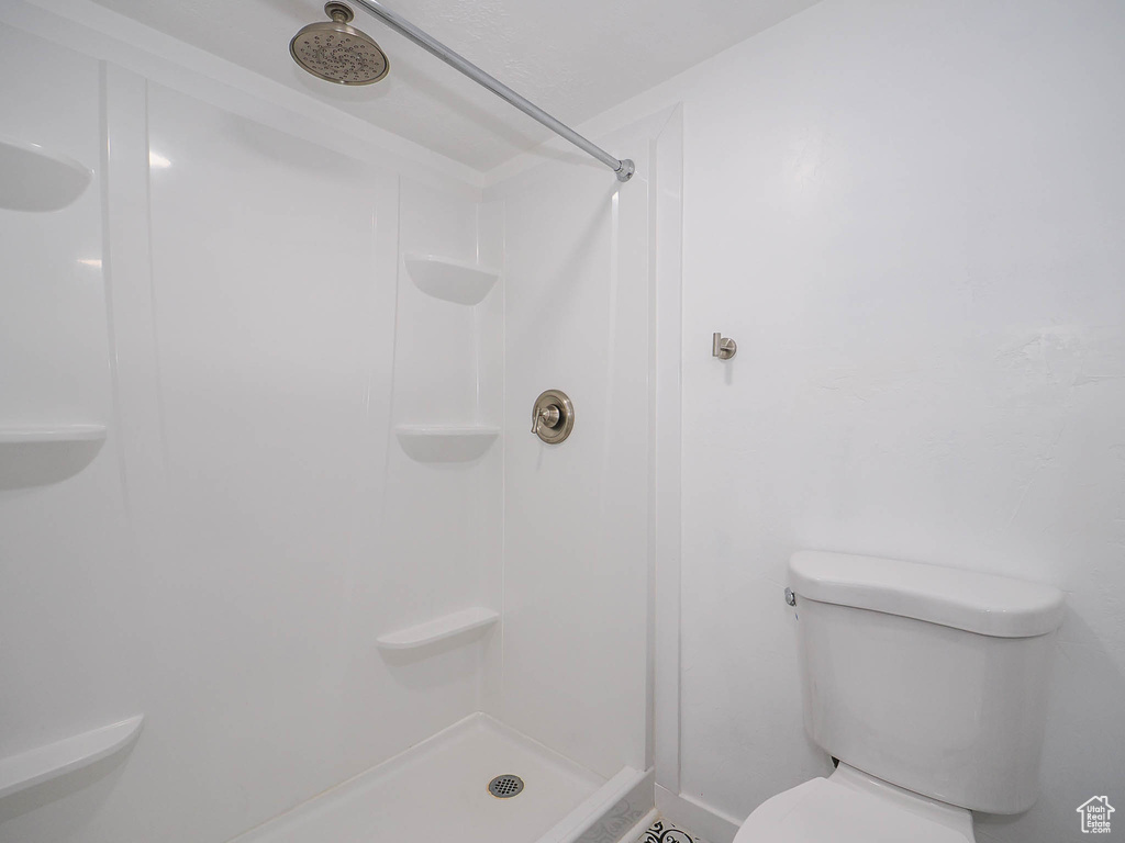 Bathroom with a shower and toilet