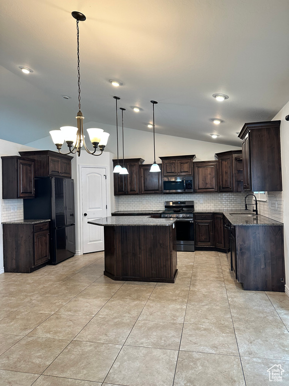 Kitchen featuring backsplash, stainless steel appliances, a kitchen island, an inviting chandelier, and pendant lighting