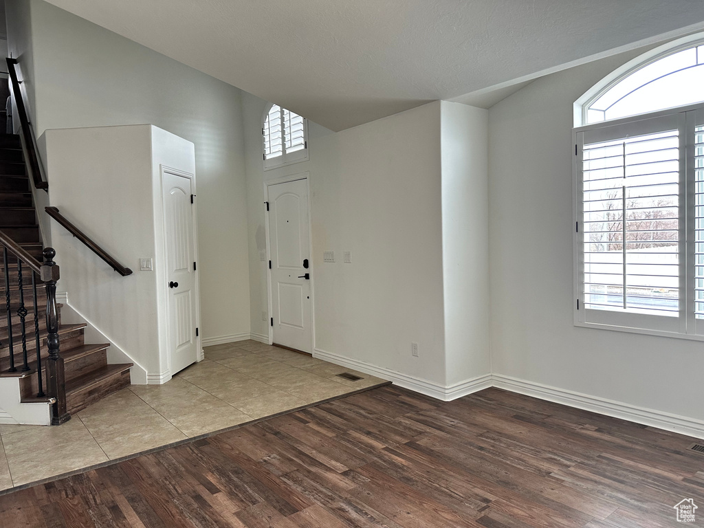 Entryway with plenty of natural light and light tile floors