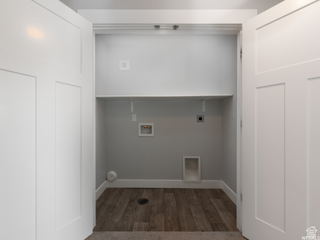 Laundry room with hookup for an electric dryer, hookup for a washing machine, and dark wood-type flooring