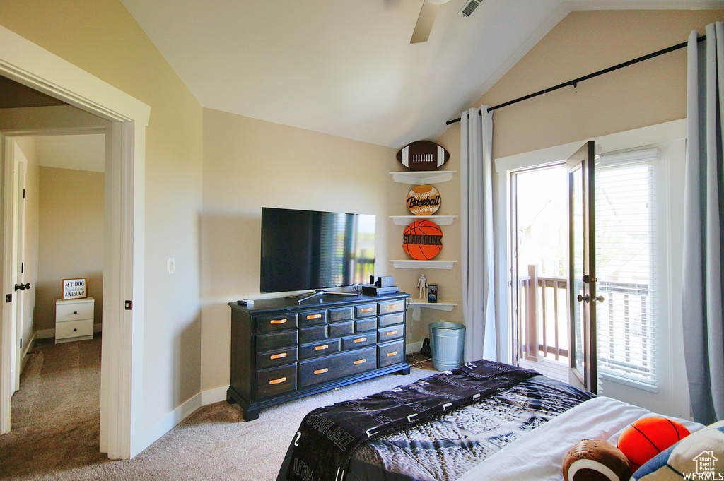 Bedroom featuring french doors, vaulted ceiling, ceiling fan, and light carpet