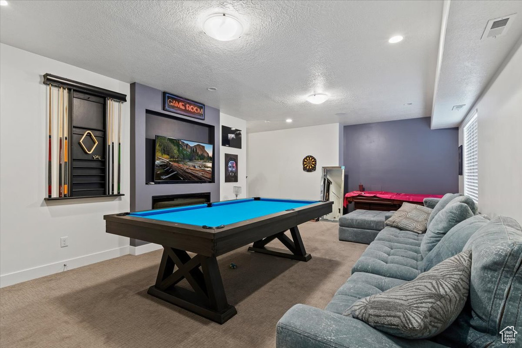 Game room with billiards, carpet floors, and a textured ceiling