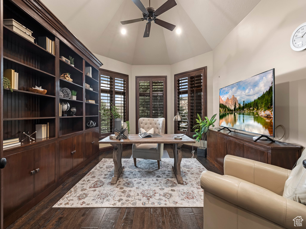 Office featuring dark hardwood / wood-style floors, high vaulted ceiling, and ceiling fan