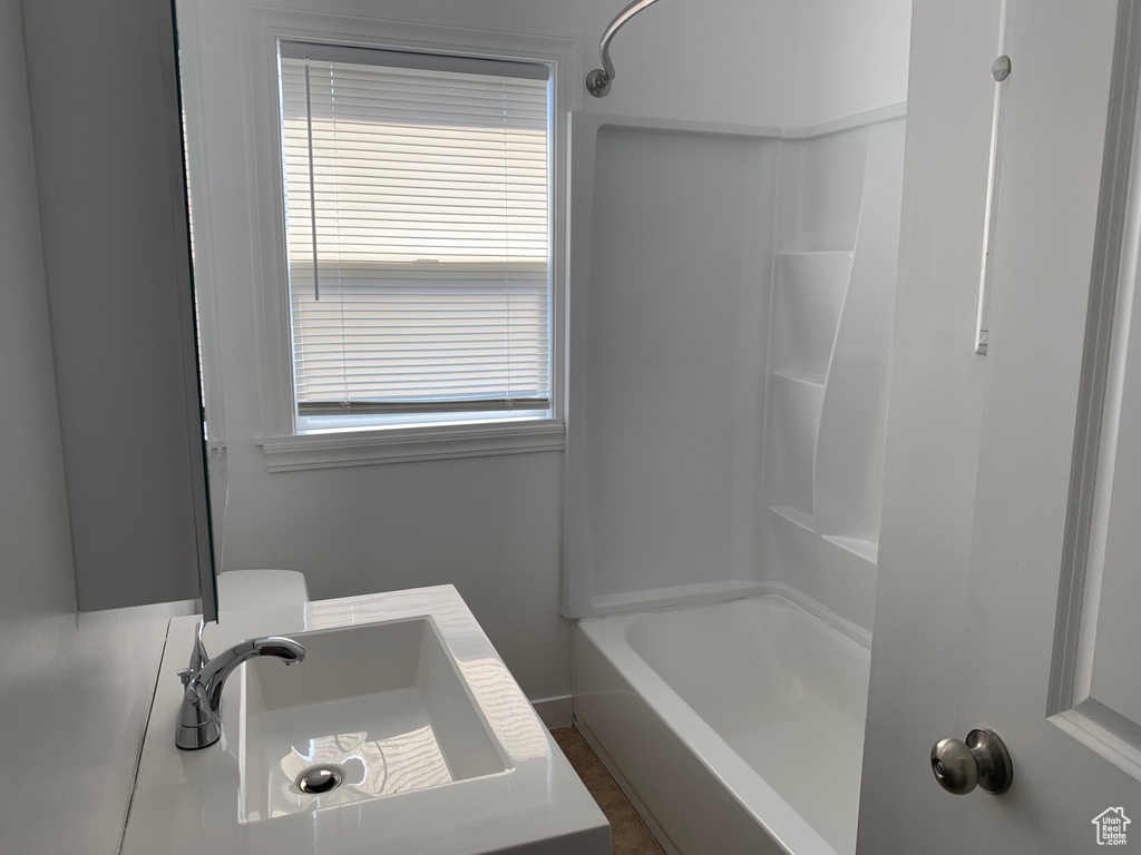 Bathroom with shower / washtub combination and sink