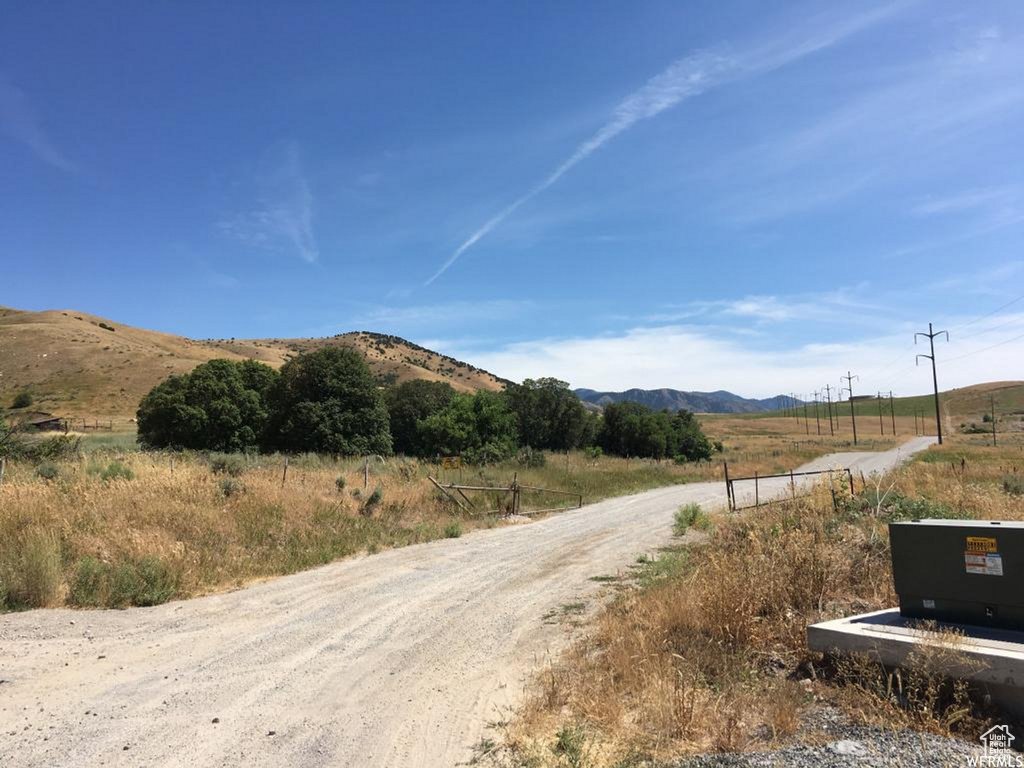 View of street featuring a rural view and a mountain view