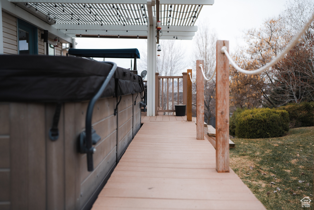Exterior space featuring a pergola and a wooden deck