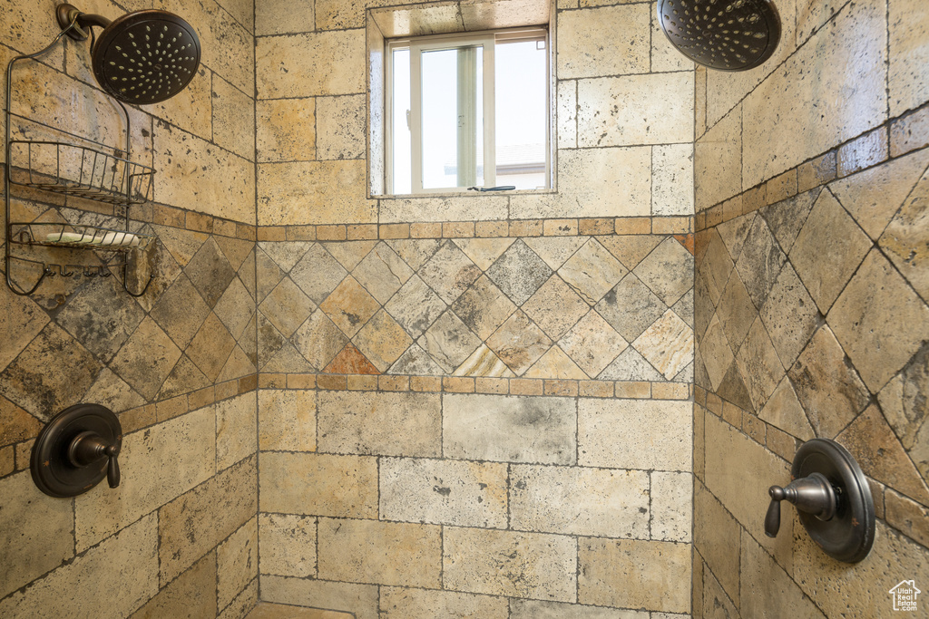 Interior details featuring a tile shower